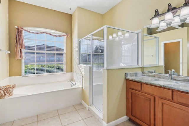 bathroom with tile patterned flooring, a shower stall, a bath, and vanity