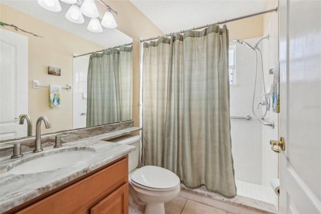 full bath with tile patterned floors, curtained shower, vanity, and toilet