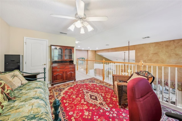 living area with visible vents and a ceiling fan