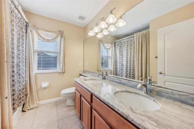 full bath featuring a sink, a healthy amount of sunlight, and tile patterned floors