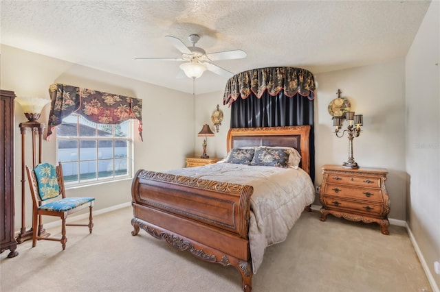 carpeted bedroom with baseboards, a textured ceiling, and ceiling fan