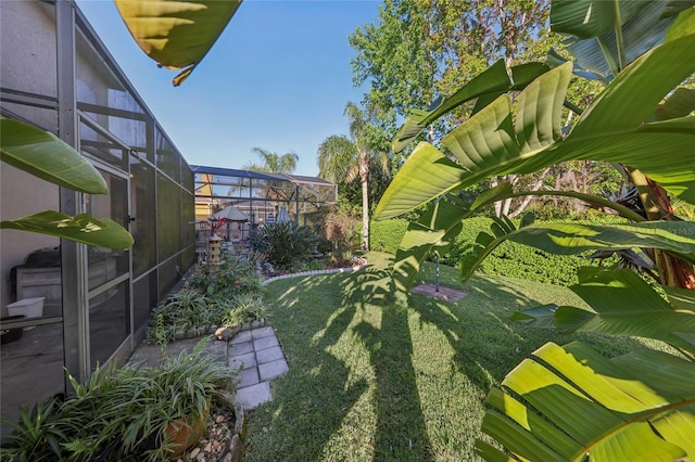 view of yard featuring a lanai