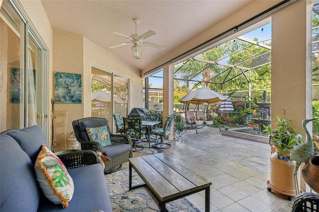 sunroom with ceiling fan