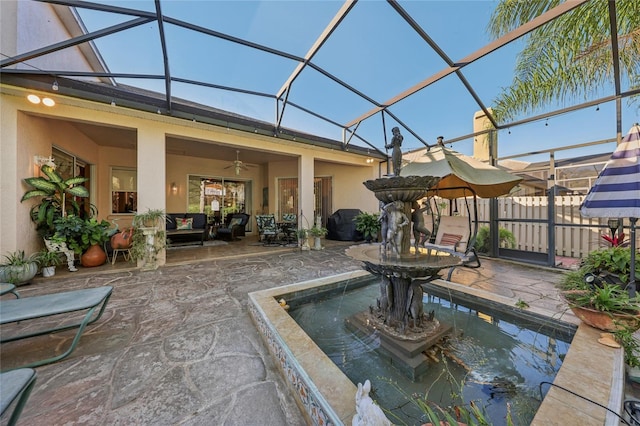 view of patio / terrace featuring an outdoor living space and glass enclosure