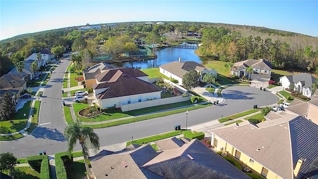 bird's eye view featuring a water view and a residential view