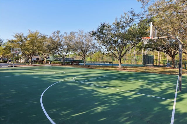 view of sport court featuring community basketball court and fence