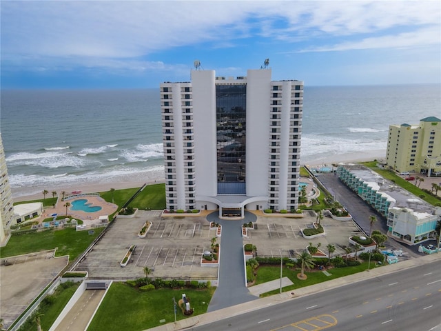 bird's eye view with a beach view and a water view