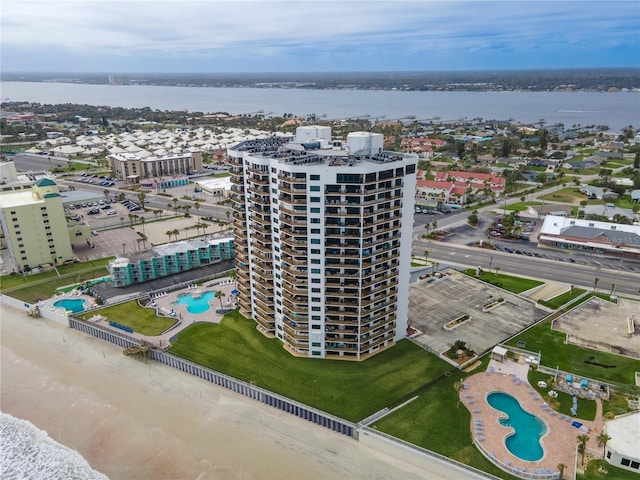 birds eye view of property with a water view