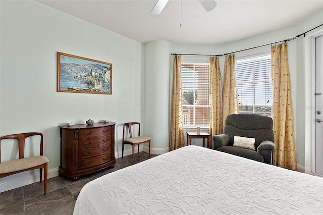 bedroom with baseboards and a ceiling fan