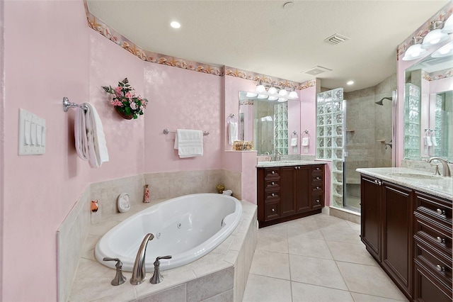 full bath with visible vents, a shower stall, vanity, tile patterned flooring, and a tub with jets