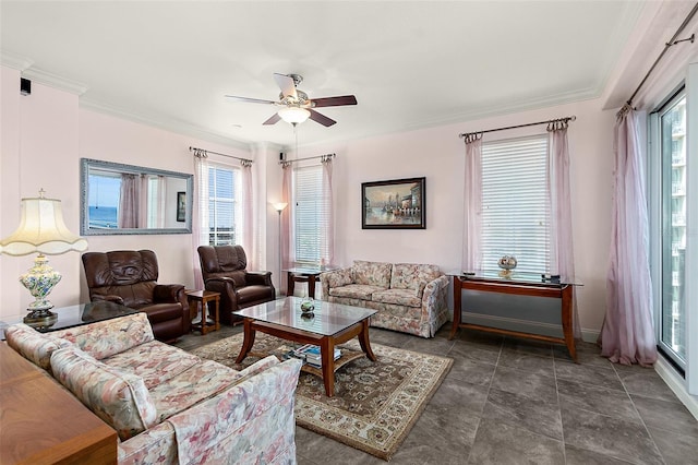 living room featuring a ceiling fan, a wealth of natural light, and crown molding