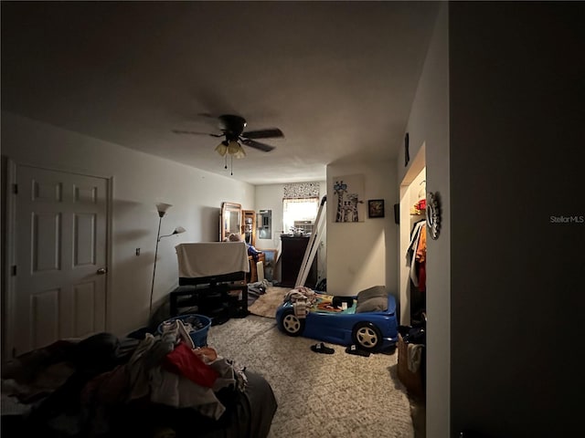 carpeted bedroom with a ceiling fan