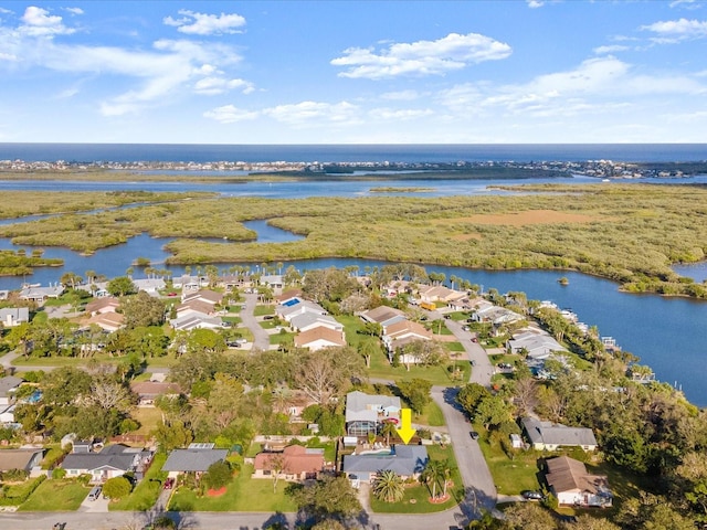 birds eye view of property featuring a residential view and a water view