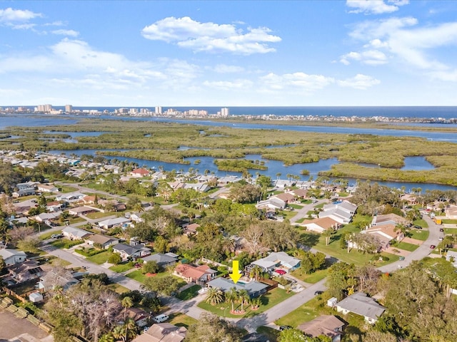 birds eye view of property with a residential view and a water view