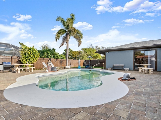 view of pool featuring a patio, a fenced backyard, and a fenced in pool