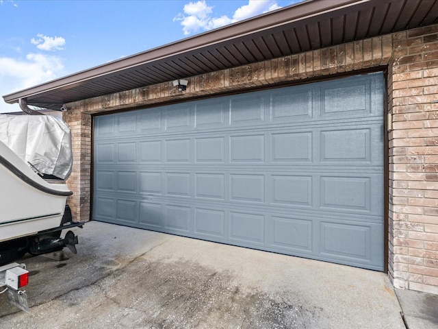 garage featuring concrete driveway