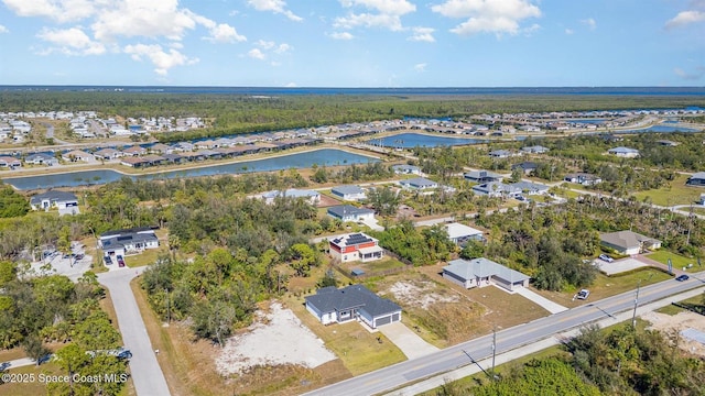 aerial view featuring a water view and a residential view