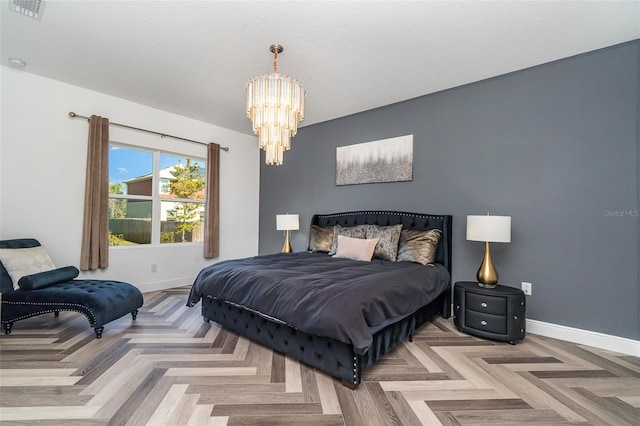 bedroom featuring a textured ceiling, an inviting chandelier, visible vents, and baseboards