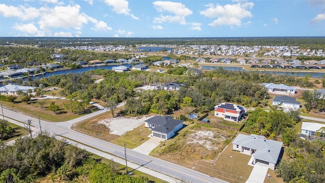 bird's eye view featuring a residential view and a water view