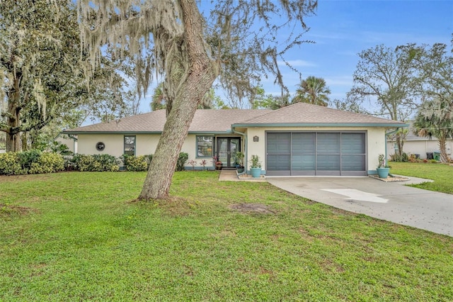 ranch-style home featuring a garage, driveway, a front lawn, and stucco siding