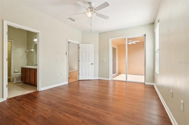 3691 Titanic Cir, Melbourne, FL 32903 - unfurnished bedroom featuring wood finished floors and baseboards