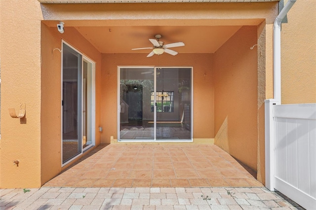 3691 Titanic Cir, Melbourne, FL 32903 - entrance to property featuring a ceiling fan, stucco siding, and a patio area