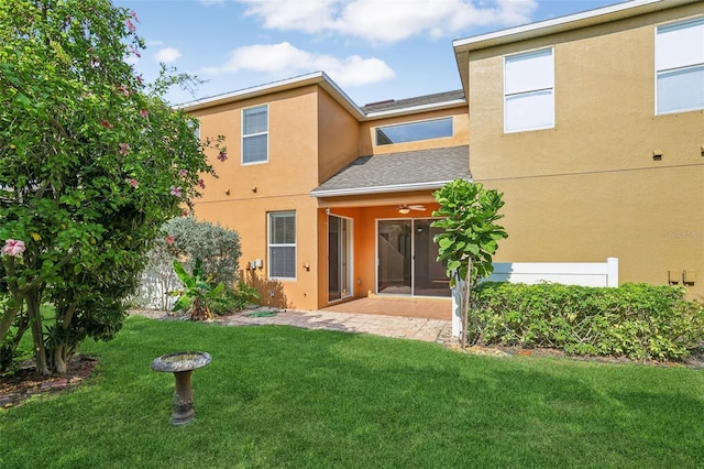 3691 Titanic Cir, Melbourne, FL 32903 - back of house featuring stucco siding, a lawn, a patio, a shingled roof, and ceiling fan