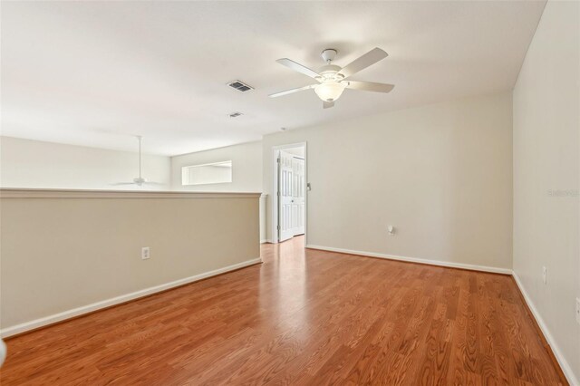 3691 Titanic Cir, Melbourne, FL 32903 - unfurnished room featuring ceiling fan, wood finished floors, and baseboards