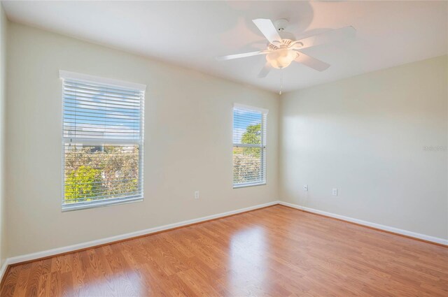 3691 Titanic Cir, Melbourne, FL 32903 - spare room featuring light wood-style floors, baseboards, and ceiling fan