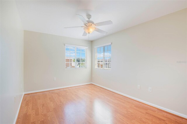 3691 Titanic Cir, Melbourne, FL 32903 - empty room with wood finished floors, baseboards, and ceiling fan