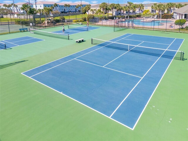 3691 Titanic Cir, Melbourne, FL 32903 - view of tennis court featuring community basketball court and a residential view