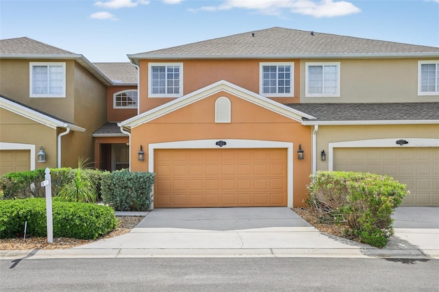 3691 Titanic Cir, Melbourne, FL 32903 - townhome / multi-family property featuring stucco siding, driveway, and an attached garage