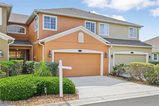3691 Titanic Cir, Melbourne, FL 32903 - view of front of house with an attached garage, stucco siding, and driveway