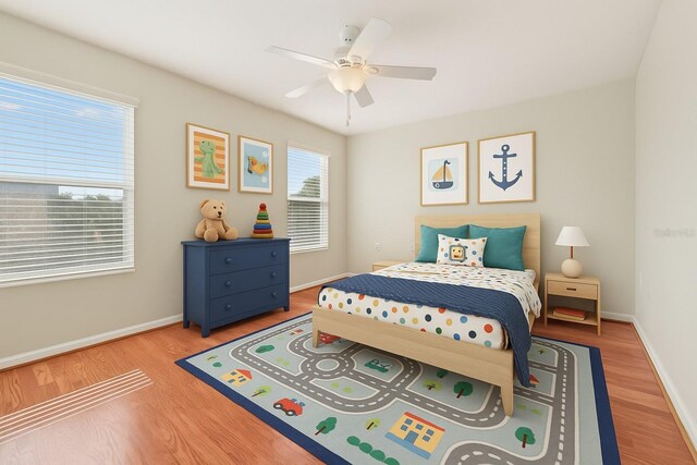 3691 Titanic Cir, Melbourne, FL 32903 - bedroom with baseboards, wood finished floors, and ceiling fan