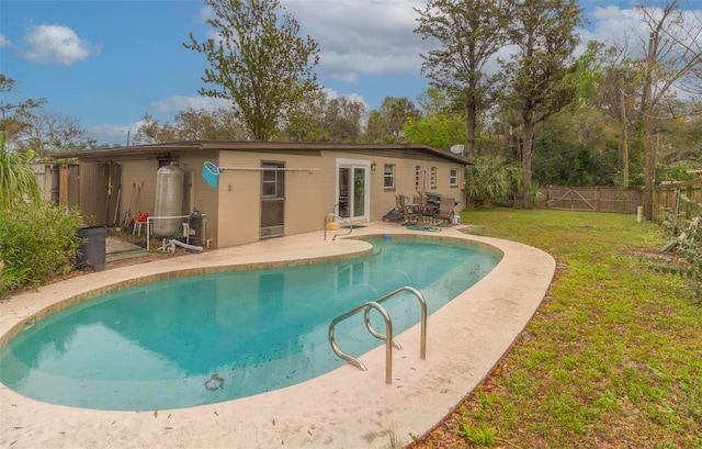 view of pool with a patio, a yard, a fenced backyard, and a fenced in pool