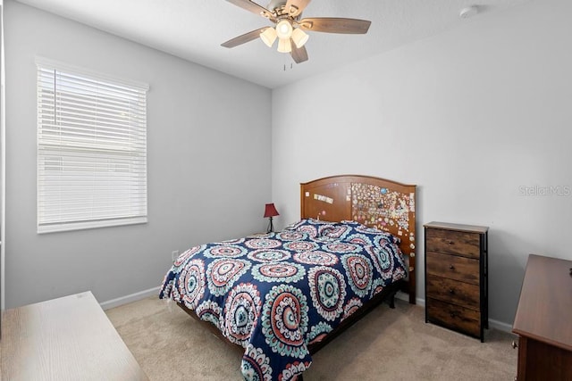 bedroom with carpet floors, ceiling fan, and baseboards