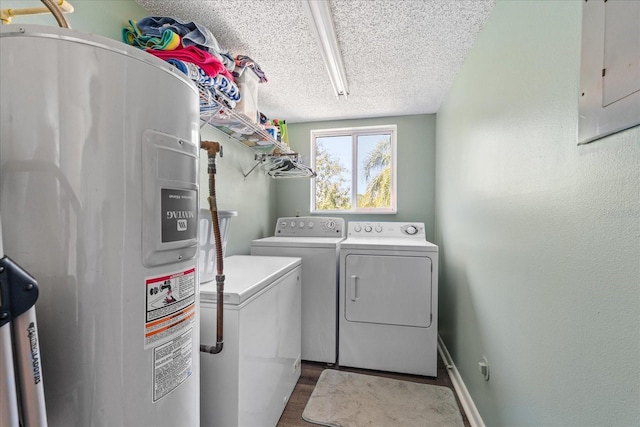 washroom featuring a textured ceiling, laundry area, water heater, independent washer and dryer, and electric panel