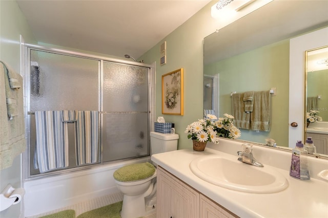 full bath with enclosed tub / shower combo, visible vents, vanity, and toilet