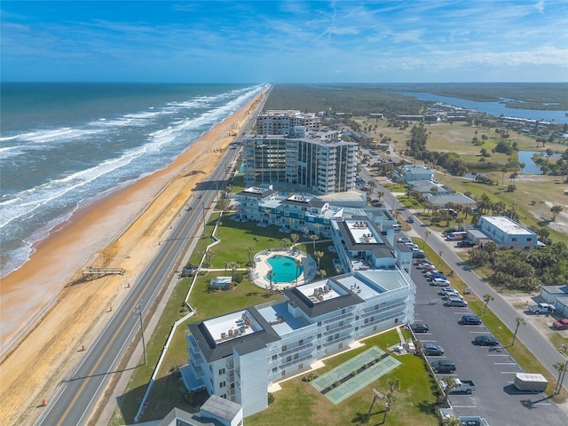 bird's eye view featuring a water view and a view of the beach