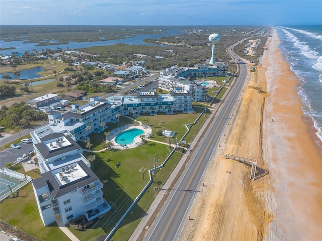 bird's eye view with a water view and a view of the beach