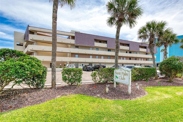 view of property with uncovered parking