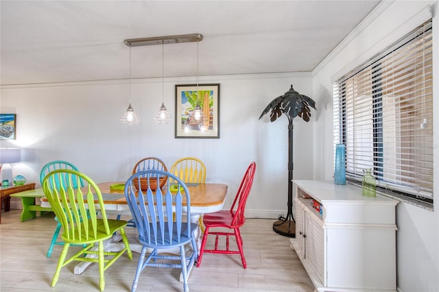 dining area featuring baseboards