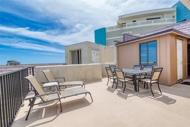 view of patio featuring outdoor dining area