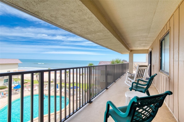 balcony featuring a water view