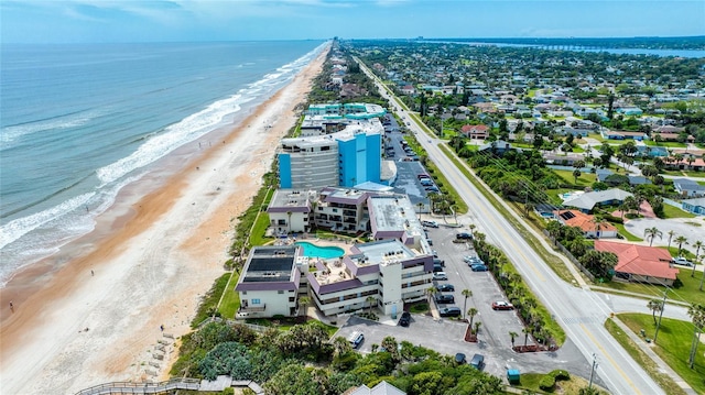 aerial view with a water view and a view of the beach