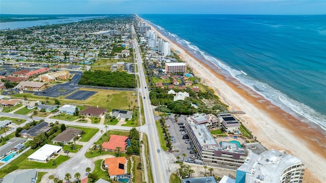 aerial view featuring a water view and a view of the beach