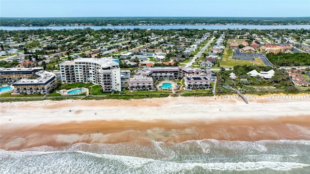 drone / aerial view with a view of the beach and a water view