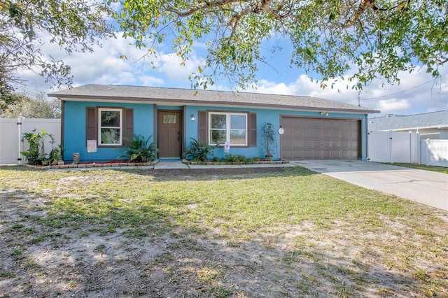 ranch-style house with a garage, fence, a front lawn, and stucco siding