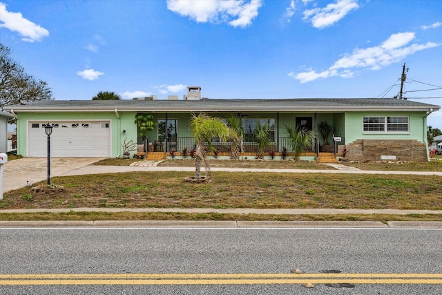 single story home featuring a porch, driveway, and an attached garage