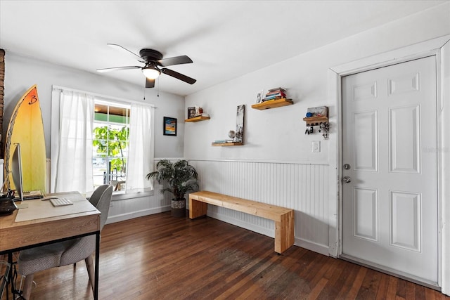 office with a ceiling fan, wainscoting, and hardwood / wood-style floors